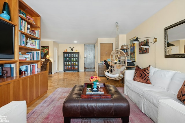 500 E 83rd St Unit 12C, New York City, NY 10028 - living room featuring baseboards