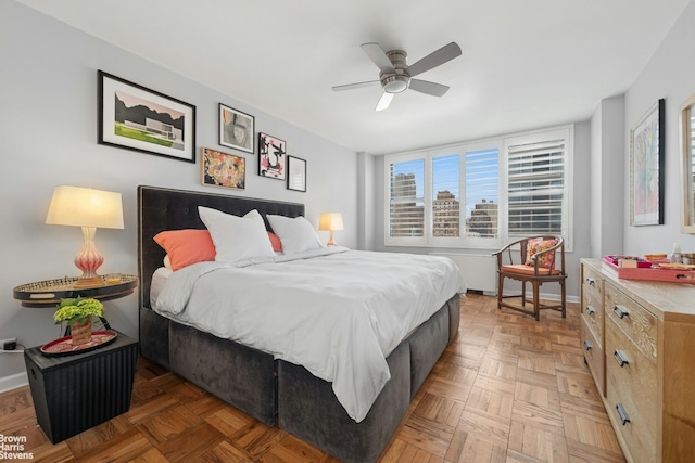 500 E 83rd St Unit 12C, New York City, NY 10028 - bedroom featuring baseboards and a ceiling fan