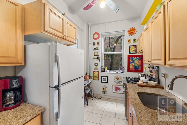 500 Grand St Cga, Unit Cga, New York City, NY 10002 - kitchen featuring freestanding refrigerator, light tile patterned floors, light brown cabinets, and ceiling fan