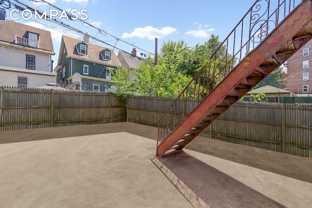 362 Webster Ave, New York City, NY 11230 - fenced backyard with a patio and stairs