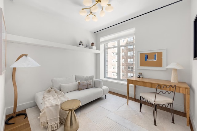 1228 Madison Ave Unit 4, New York City, NY 10128 - living area featuring a chandelier and wood finished floors