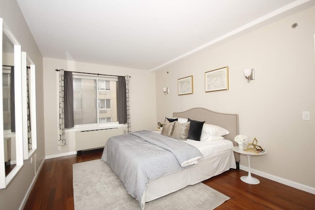 603 W 148th St Unit 3, New York City, NY 10031 - bedroom featuring radiator heating unit and wood finished floors