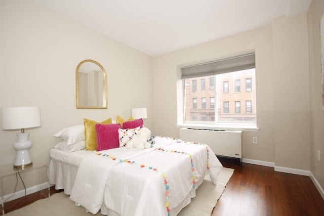 603 W 148th St Unit 3, New York City, NY 10031 - bedroom with radiator and wood finished floors