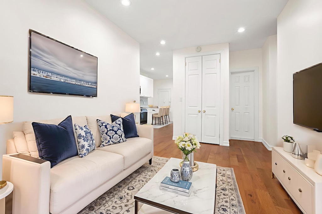 9 Pinehurst Ave Unit 1-C, New York City, NY 10033 - living area with light wood-type flooring and recessed lighting