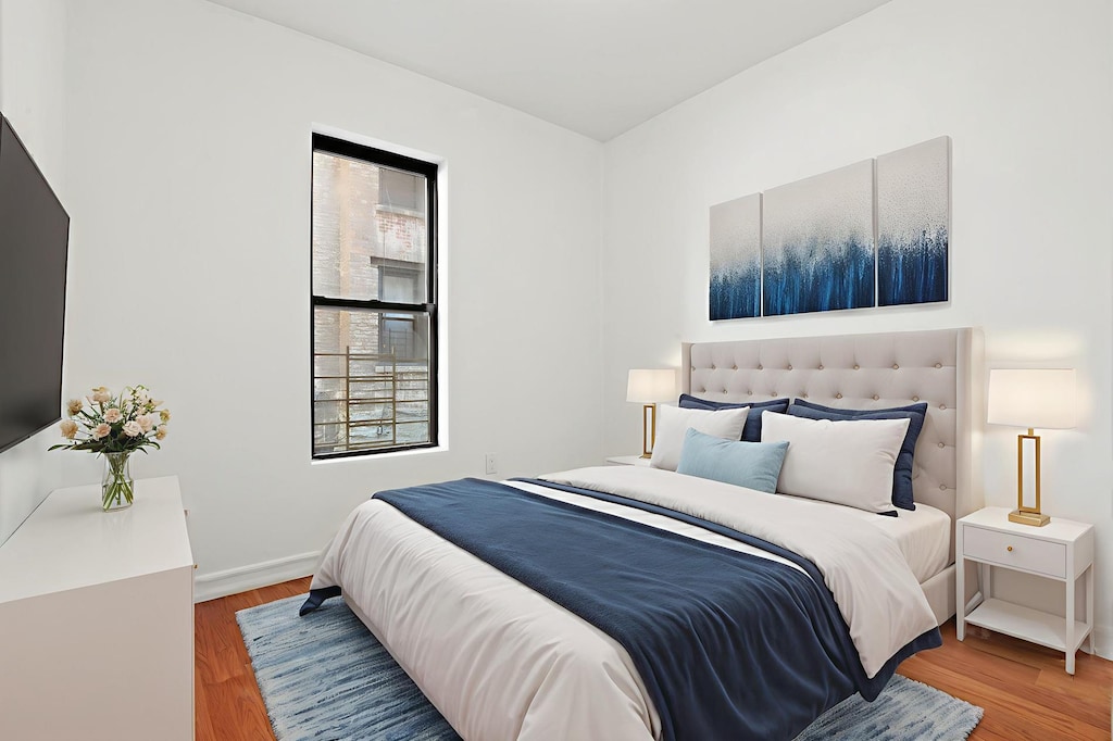 9 Pinehurst Ave Unit 1-C, New York City, NY 10033 - bedroom featuring wood finished floors