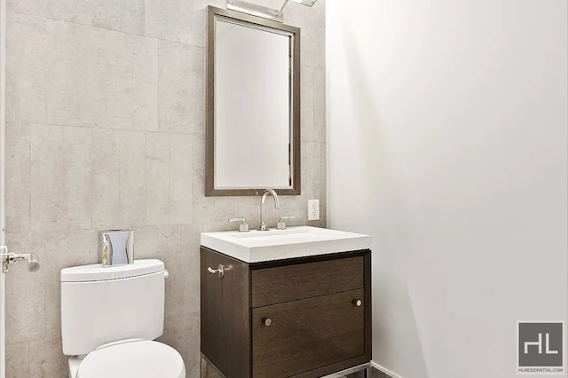 301 E 50th St Unit 5B, New York City, NY 10022 - half bathroom with vanity and tile walls