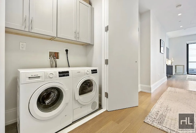 301 E 50th St Unit 5B, New York City, NY 10022 - washroom with cabinet space, light wood finished floors, separate washer and dryer, and recessed lighting
