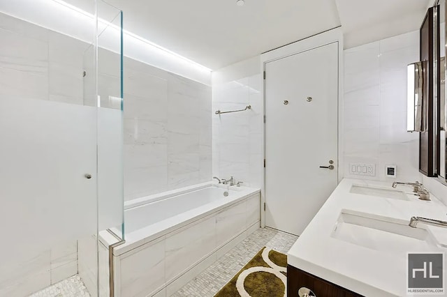 301 E 50th St Unit 5B, New York City, NY 10022 - bathroom featuring double vanity, shower / tub combination, and tile patterned flooring