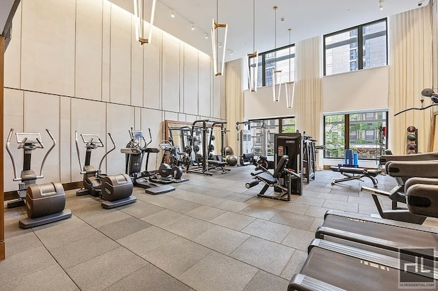 301 E 50th St Unit 5B, New York City, NY 10022 - exercise room featuring a high ceiling and track lighting