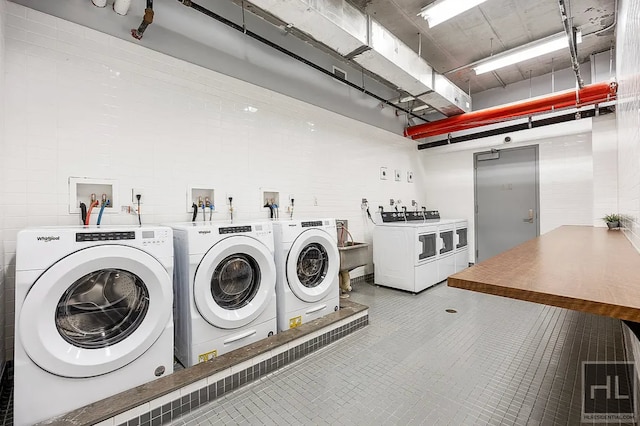 301 E 50th St Unit 5B, New York City, NY 10022 - community laundry room featuring washer and clothes dryer