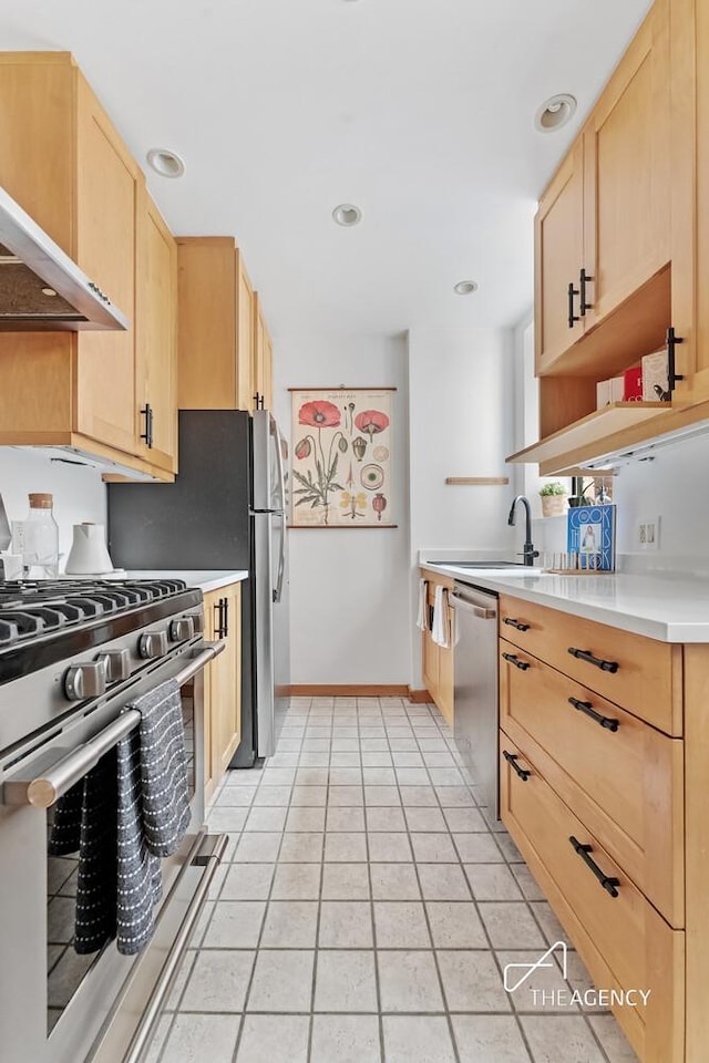 422 State St Unit 6, New York City, NY 11217 - kitchen featuring stainless steel appliances, light brown cabinets, ventilation hood, light countertops, and light tile patterned flooring