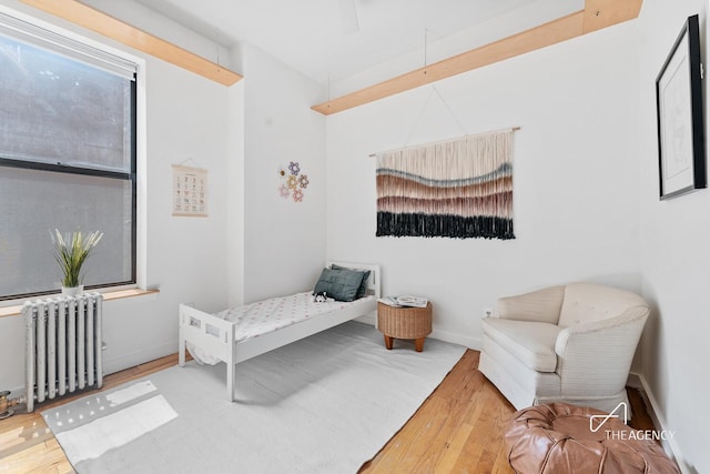 422 State St Unit 6, New York City, NY 11217 - bedroom featuring radiator heating unit and wood finished floors
