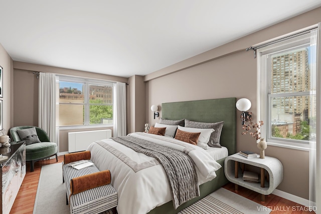 251 E 32nd St Unit 8H, New York City, NY 10016 - bedroom with wood finished floors and radiator