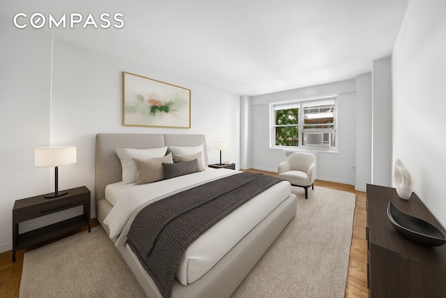 50 Sutton Pl S Unit 5E, New York City, NY 10022 - bedroom featuring light wood-type flooring and cooling unit