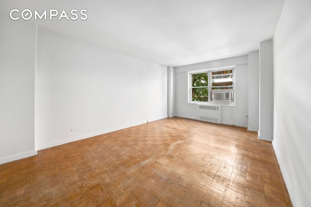 50 Sutton Pl S Unit 5E, New York City, NY 10022 - unfurnished room with radiator heating unit and baseboards