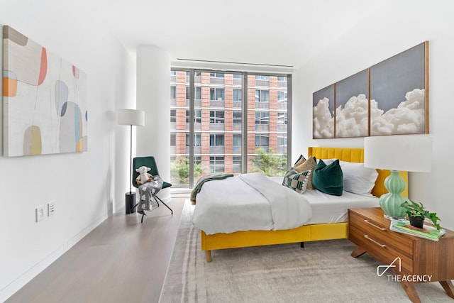 520 W 28th St Unit 7, New York City, NY 10001 - bedroom with wood finished floors and multiple windows