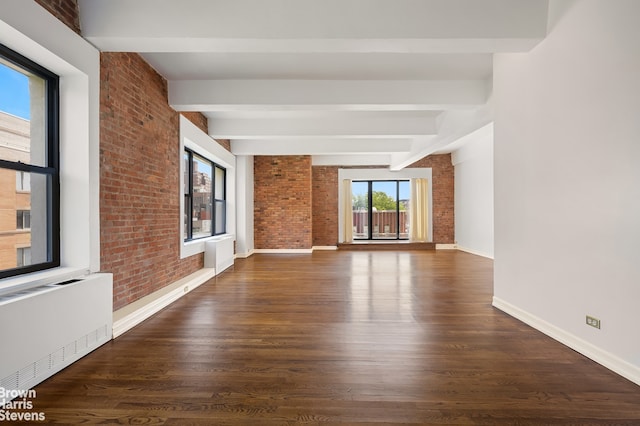 380 W 12th St Unit 6B, New York City, NY 10014 - unfurnished living room with radiator, brick wall, beam ceiling, and wood finished floors