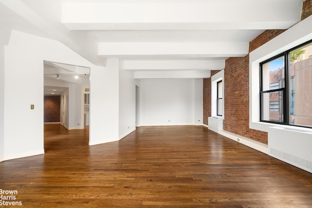 380 W 12th St Unit 6B, New York City, NY 10014 - unfurnished room featuring beamed ceiling, dark wood-style floors, brick wall, and radiator heating unit