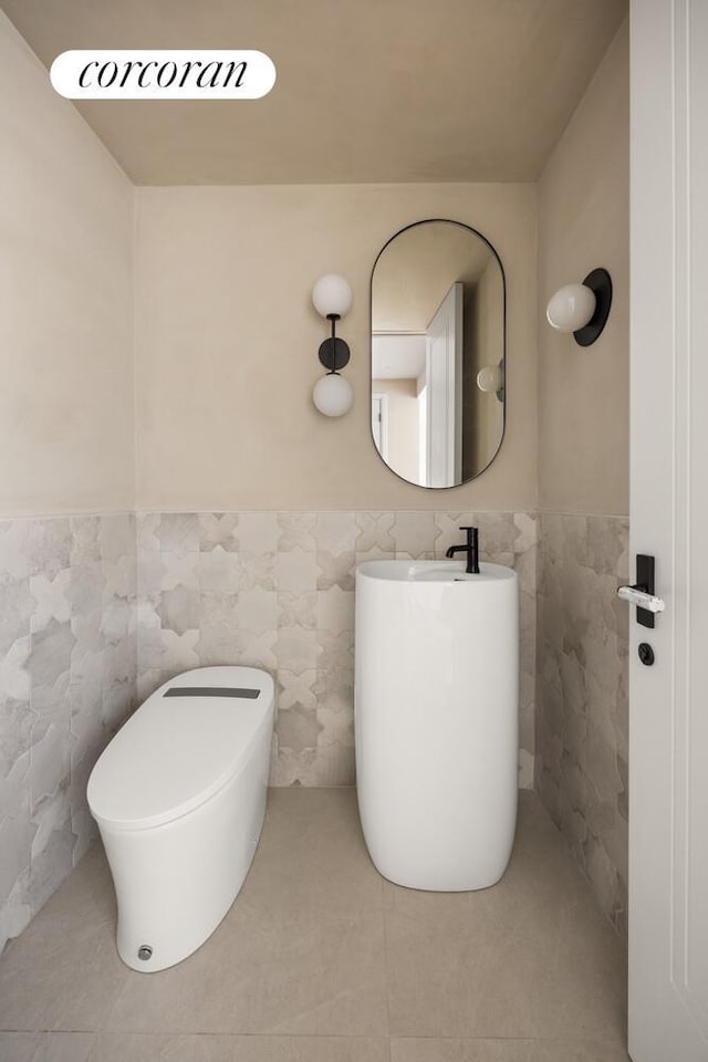 966 Bergen St, New York City, NY 11216 - bathroom featuring tile walls, wainscoting, and tile patterned flooring