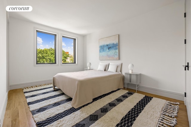 966 Bergen St, New York City, NY 11216 - bedroom featuring wood finished floors and baseboards