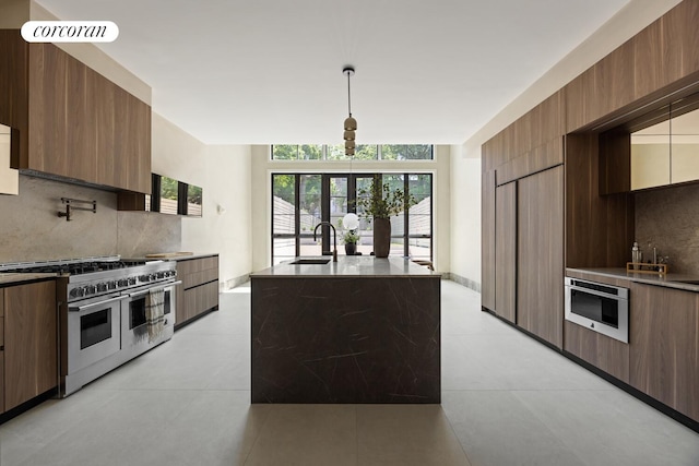 966 Bergen St, New York City, NY 11216 - kitchen with double oven range, modern cabinets, and tasteful backsplash