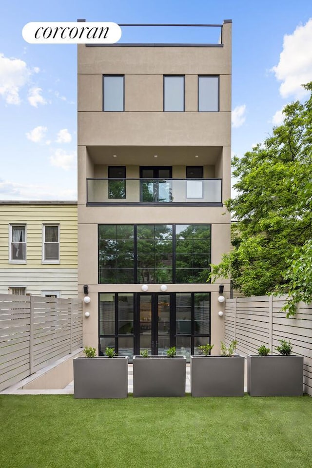 966 Bergen St, New York City, NY 11216 - back of property featuring stucco siding and a balcony