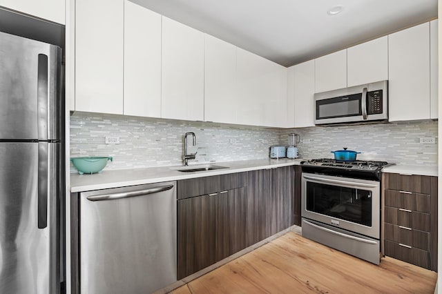 25-21 43rd Ave Unit 511, New York City, NY 11101 - kitchen featuring appliances with stainless steel finishes, modern cabinets, and light countertops