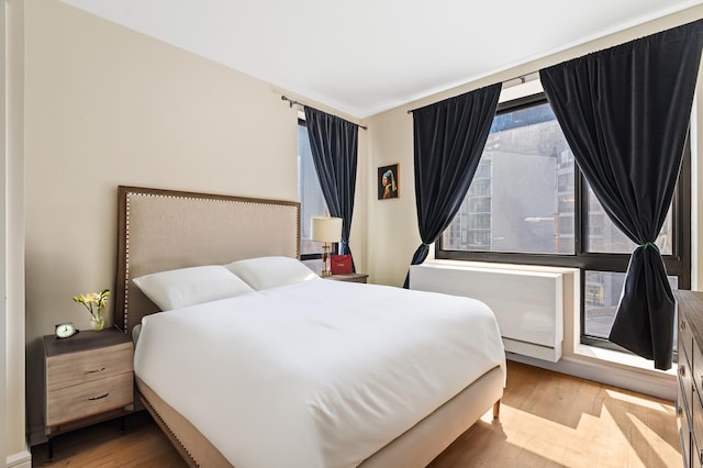 25-21 43rd Ave Unit 511, New York City, NY 11101 - bedroom featuring light wood-style flooring