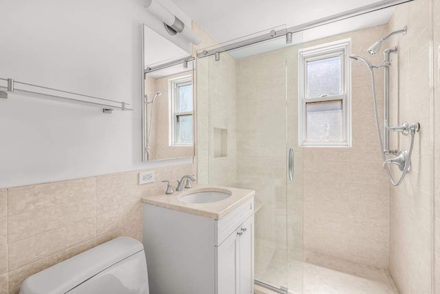 40 E 9th St Unit 9K, New York City, NY 10003 - full bath featuring healthy amount of natural light, a shower stall, vanity, and tile walls