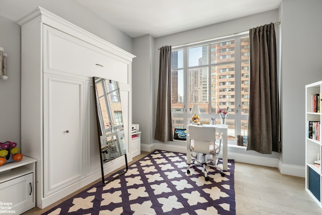200 E 95th St Unit 8C, New York City, NY 10128 - office featuring light wood-style flooring and baseboards