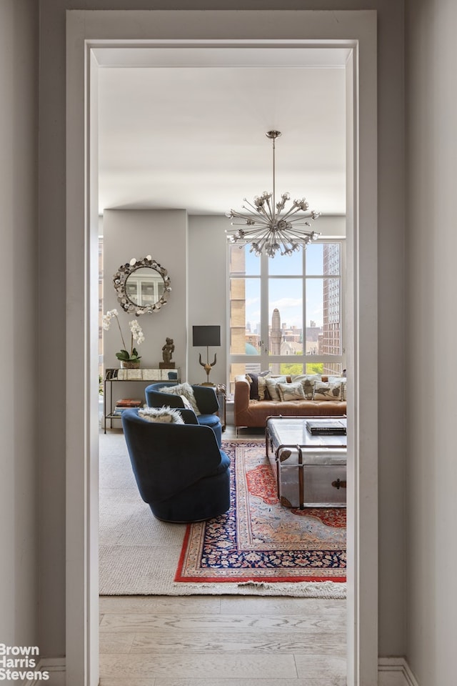 200 E 95th St Unit 8C, New York City, NY 10128 - living area featuring a chandelier and wood finished floors