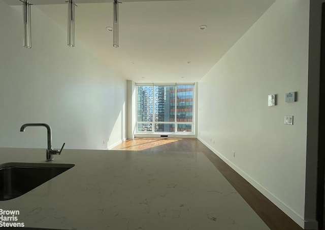 27-17 42nd Rd Unit 14G, New York City, NY 11101 - unfurnished room featuring a wall of windows and finished concrete flooring