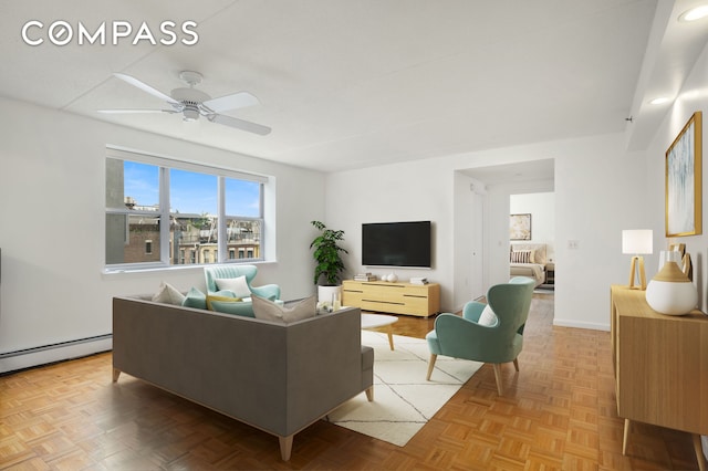 101 W 117th St Unit 5E, New York City, NY 10026 - living area featuring a baseboard heating unit and a ceiling fan