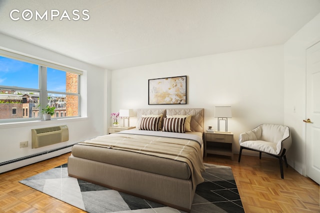 101 W 117th St Unit 5E, New York City, NY 10026 - bedroom featuring a baseboard radiator and a wall unit AC