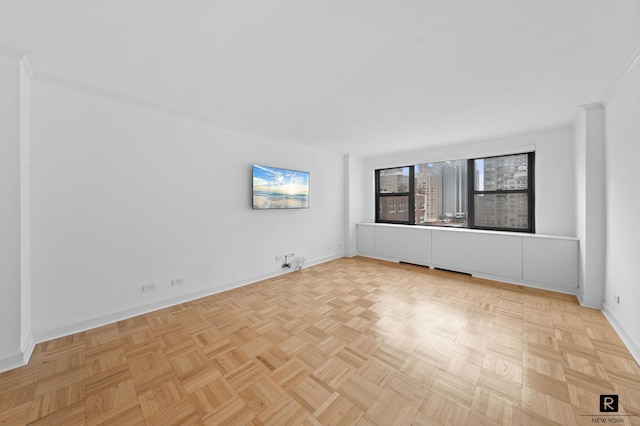301 E 69th St Unit 12-L, New York City, NY 10021 - empty room featuring baseboards and ornamental molding