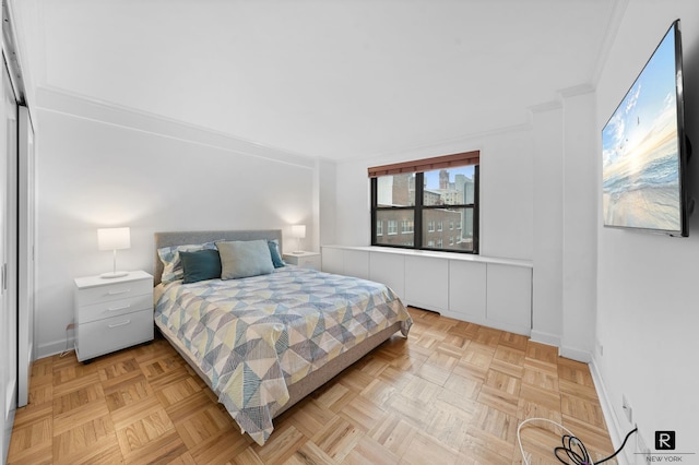 301 E 69th St Unit 12-L, New York City, NY 10021 - bedroom featuring baseboards