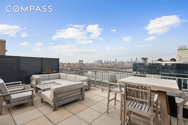 440 Kent Ave Unit F18, New York City, NY 11249 - view of patio / terrace featuring an outdoor living space and a skyline view