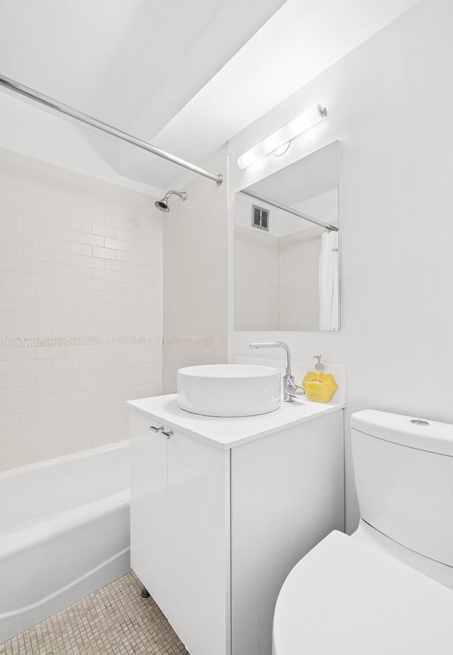239 E 79th St Unit 9A, New York City, NY 10075 - full bathroom featuring vanity, shower / bath combo with shower curtain, and tile patterned floors