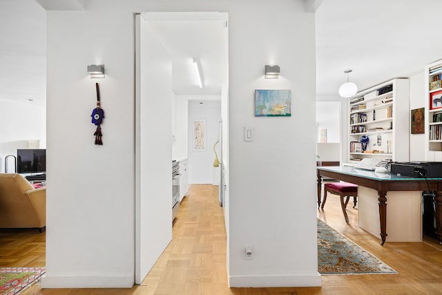 239 E 79th St Unit 9A, New York City, NY 10075 - hallway featuring a desk and built in shelves