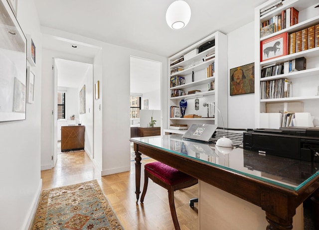 239 E 79th St Unit 9A, New York City, NY 10075 - office area featuring built in shelves and baseboards