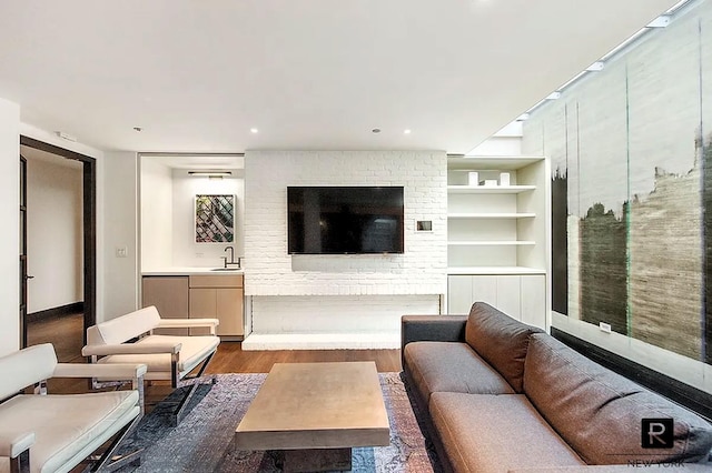 211 E 13th St Unit 6-D, New York City, NY 10003 - living room featuring dark wood-style flooring, built in features, and recessed lighting