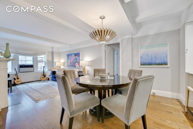 7 E 85th St Unit 5Ab, New York City, NY 10028 - dining area featuring a chandelier, beamed ceiling, light wood finished floors, and cooling unit