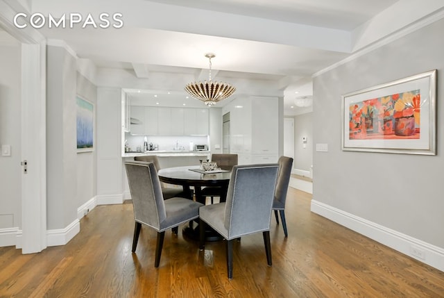 7 E 85th St Unit 5Ab, New York City, NY 10028 - dining area with dark wood-type flooring and a chandelier