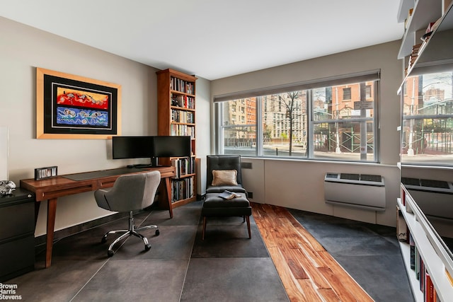 430 W 34th St Unit Lh, New York City, NY 10001 - home office with dark wood-type flooring and a wall unit AC
