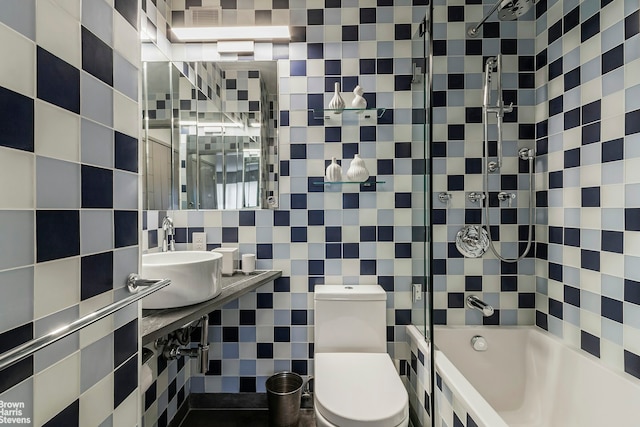 430 W 34th St Unit Lh, New York City, NY 10001 - full bathroom featuring tile walls, tiled shower / bath, and decorative backsplash