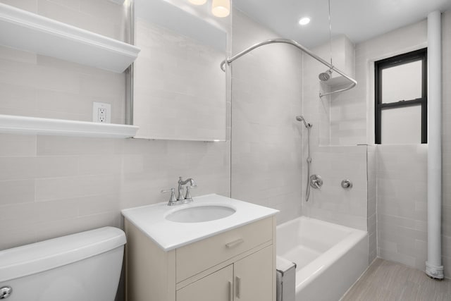 317 W 87th St Unit 7B, New York City, NY 10024 - bathroom featuring vanity, shower / tub combination, and tile walls
