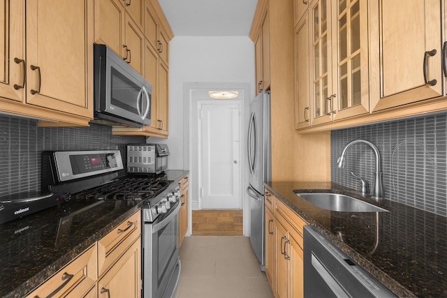 317 W 87th St Unit 7B, New York City, NY 10024 - kitchen featuring stainless steel appliances, tasteful backsplash, and dark stone counters
