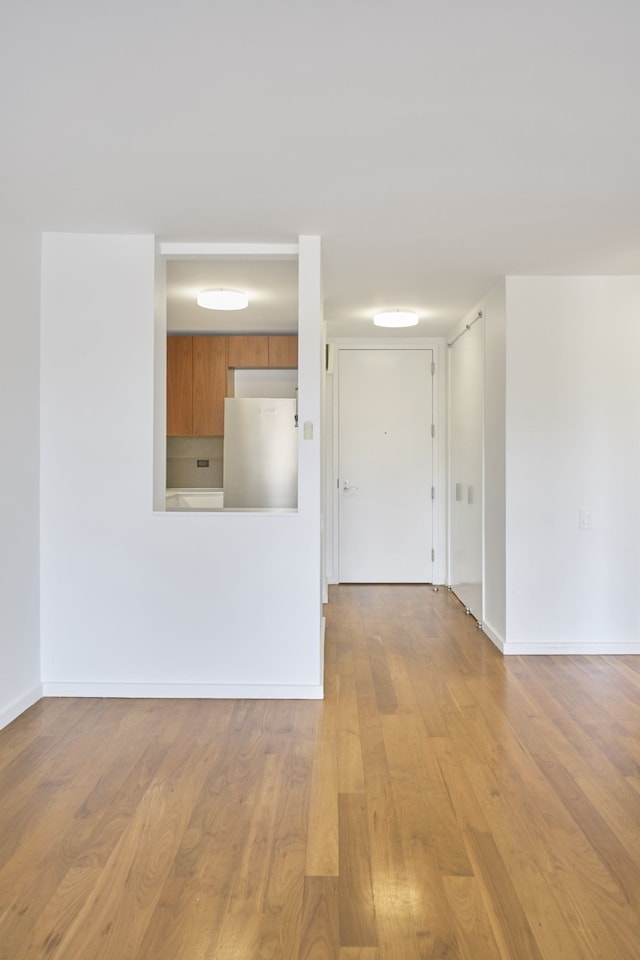515 E 72nd St Unit 9N, New York City, NY 10021 - spare room with wood finished floors and baseboards