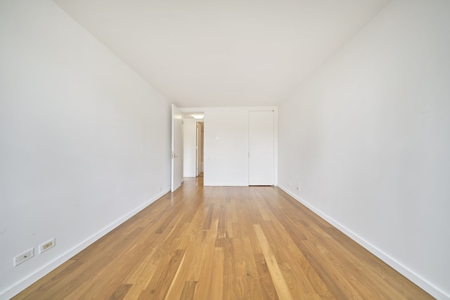 515 E 72nd St Unit 9N, New York City, NY 10021 - unfurnished bedroom with light wood-type flooring and a closet