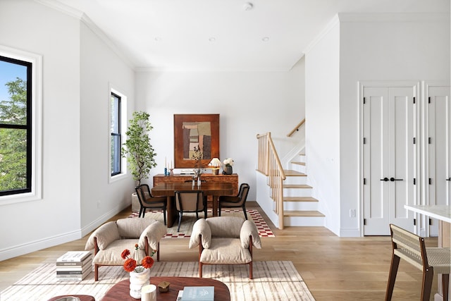 80 Cornelia St Unit 3, New York City, NY 11221 - living room featuring stairway, light wood-style flooring, and crown molding